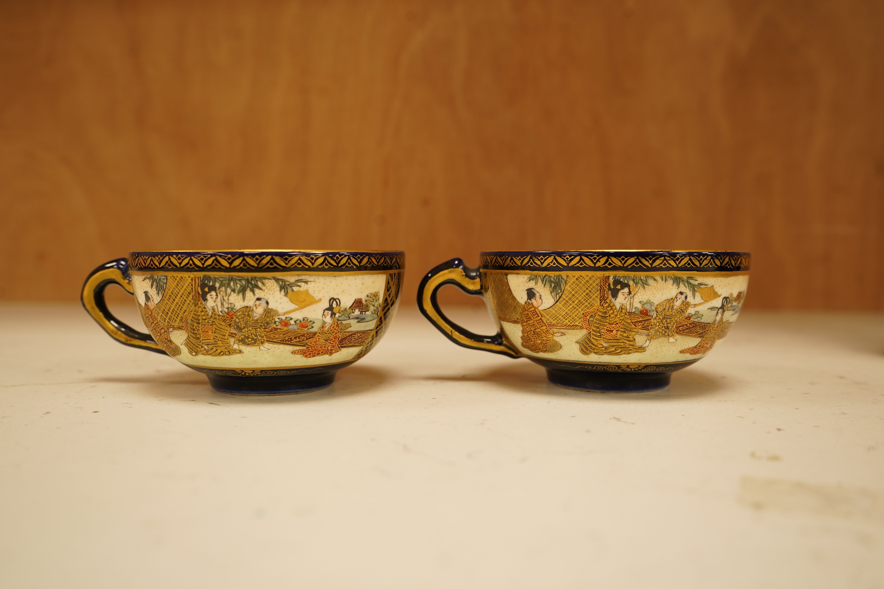 A set of six Japanese Satsuma pottery teacups and saucers, and two further saucers